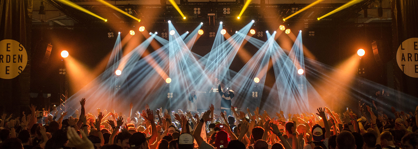 Concert stage with dramatic lighting and crowd
